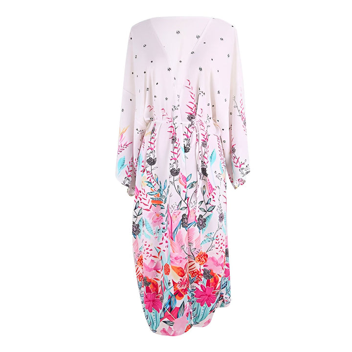 Kimono blanc long avec motif floral coloré. Vêtements de style kimono pour femmes, idéal pour un look bohème chic. Découvrez notre collection de kimonos en ligne.