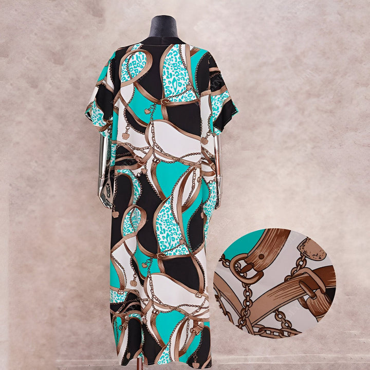 Kimono long imprimé chaînes et motifs variés. Vêtement ample, manches courtes. Idéal pour un look tendance et confortable. Découvrez notre collection de kimonos.
