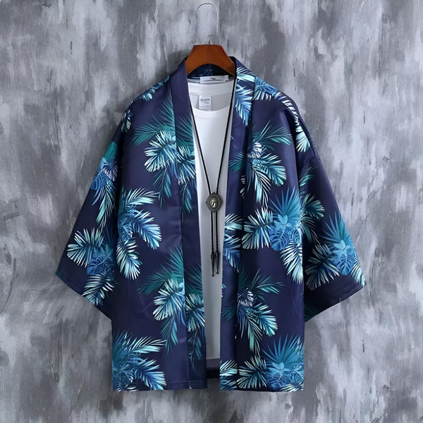 Kimono homme bleu marine à motifs de feuilles de palmier. Vêtement d'été léger et tendance. Idéal pour un look décontracté et stylé. Découvrez notre collection de kimonos pour hommes.