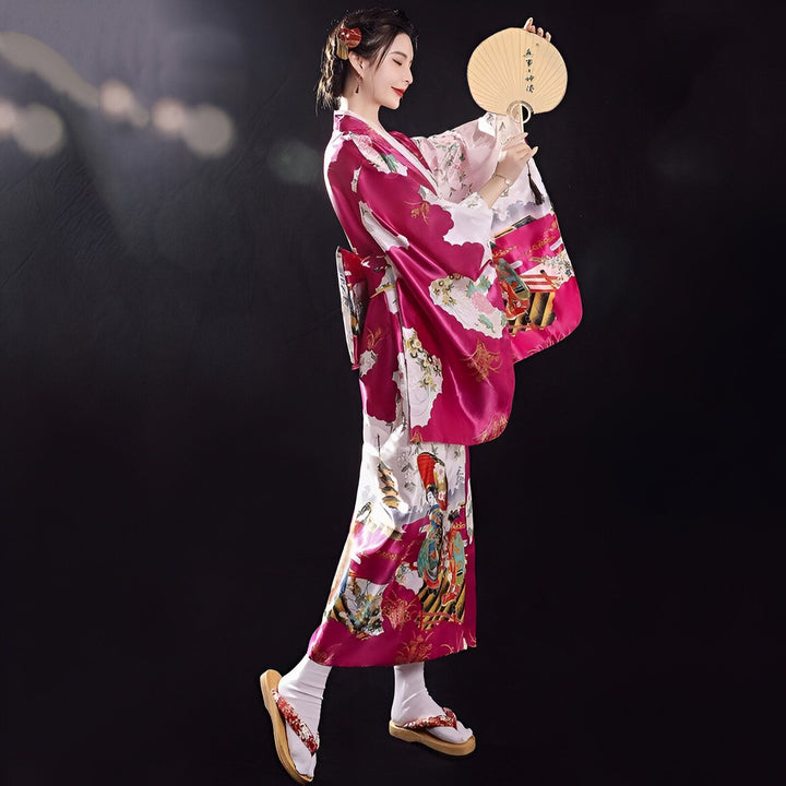 Femme en kimono rose avec éventail. Vente de kimonos traditionnels japonais. Élégance et style.