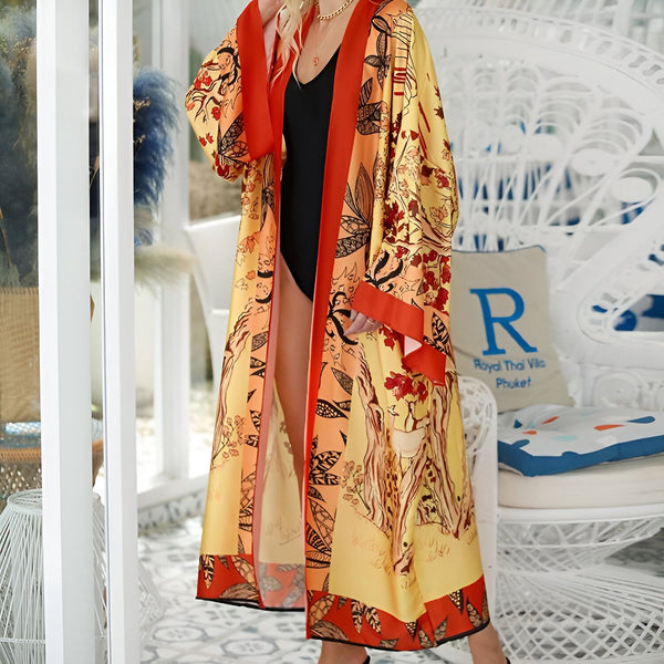 Femme portant un kimono long imprimé floral jaune et orange. Vêtement d'intérieur élégant et confortable. Boutique de kimonos en ligne.