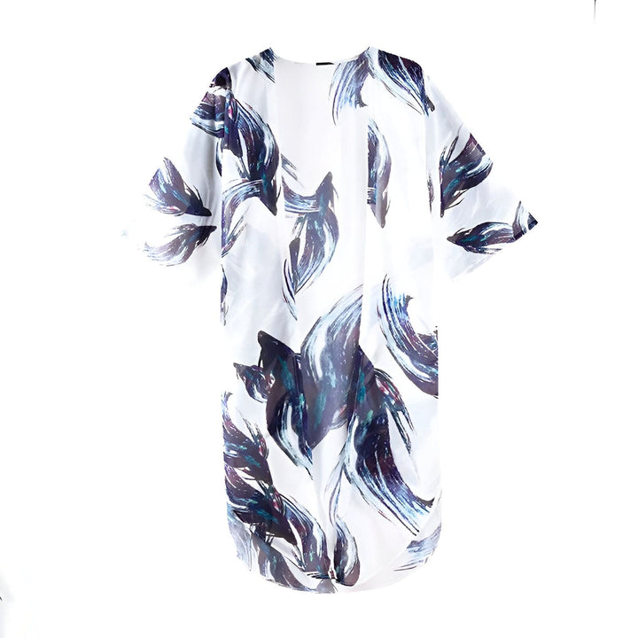 Kimono blanc à motifs abstraits bleus et noirs. Vêtement ample et léger, idéal pour un style bohème chic. Découvrez notre collection de kimonos.