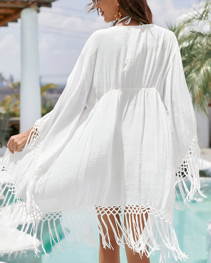 Kimono blanc à franges pour femme. Vêtement d'été léger et élégant. Idéal pour la plage ou la piscine. Découvrez notre collection de kimonos.