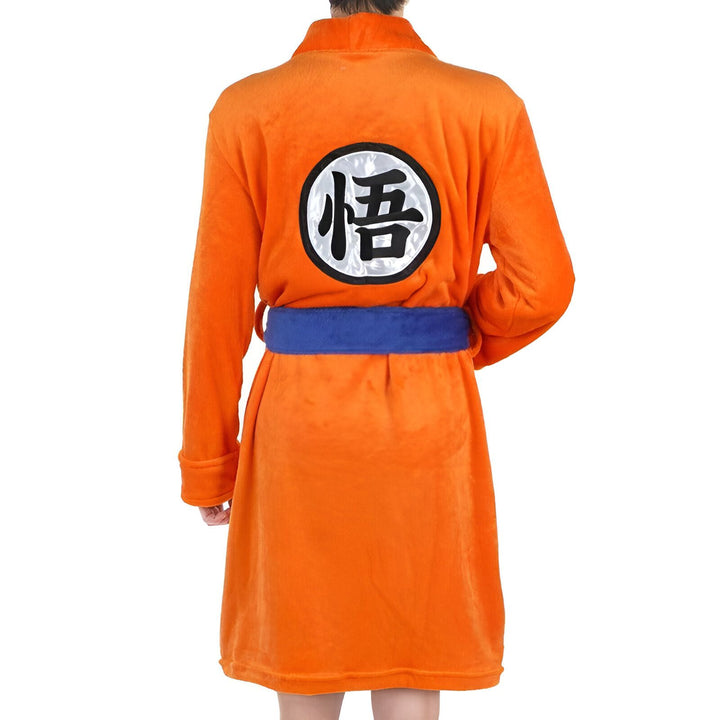 Peignoir orange de style kimono avec symbole japonais, parfait pour les fans de culture manga. Découvrez notre collection de kimonos uniques !